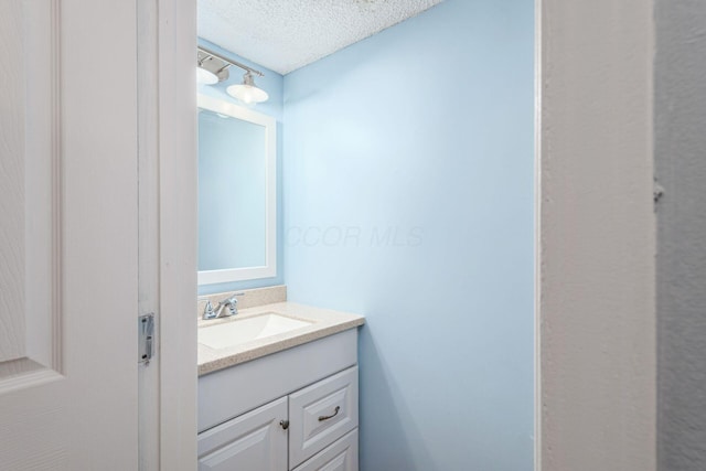 5120 Singleton Dr Unit 36D, Hilliard, OH 43026 - bathroom featuring vanity and a textured ceiling