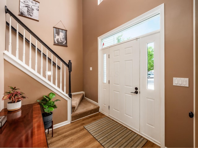 4710 Helmsbridge Ct, Grove City, OH 43123 - foyer entrance featuring wood finished floors, stairway, and baseboards