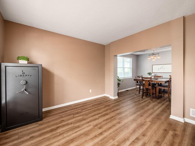 4710 Helmsbridge Ct, Grove City, OH 43123 - dining area featuring a chandelier, baseboards, and light wood-style flooring