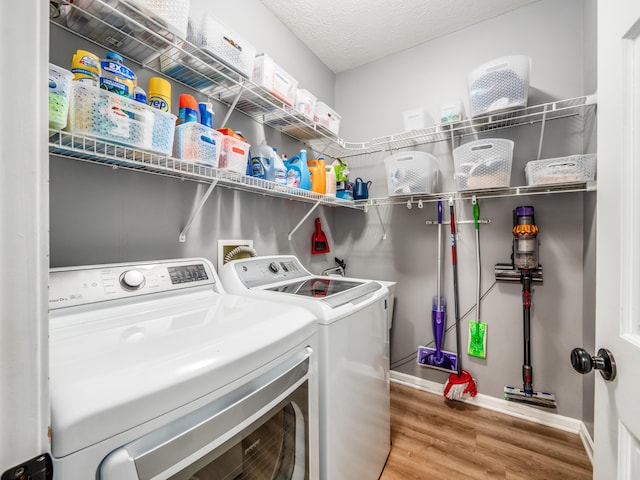 4710 Helmsbridge Ct, Grove City, OH 43123 - washroom featuring washer and dryer, wood finished floors, and baseboards