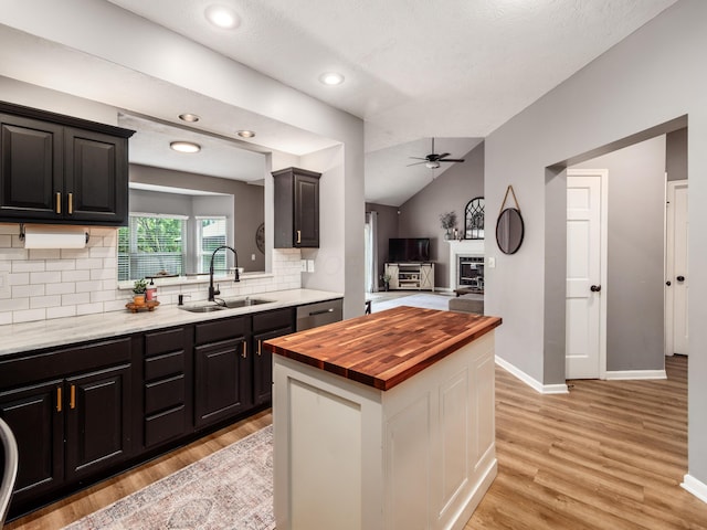 4710 Helmsbridge Ct, Grove City, OH 43123 - kitchen with wood counters, a ceiling fan, a sink, light wood-style floors, and decorative backsplash