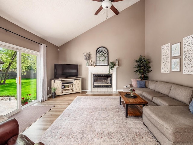 4710 Helmsbridge Ct, Grove City, OH 43123 - living area with ceiling fan, wood finished floors, a fireplace, high vaulted ceiling, and baseboards