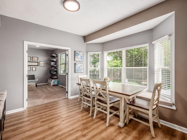 4710 Helmsbridge Ct, Grove City, OH 43123 - dining area with baseboards, light wood-style flooring, and healthy amount of natural light
