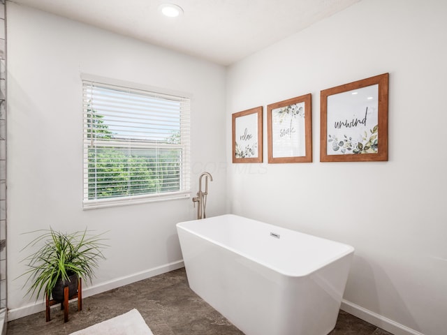 4710 Helmsbridge Ct, Grove City, OH 43123 - full bathroom with a freestanding tub, baseboards, and recessed lighting