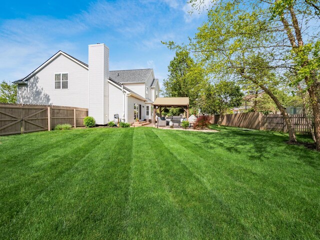 4710 Helmsbridge Ct, Grove City, OH 43123 - back of house featuring an outdoor hangout area, a chimney, and a patio area
