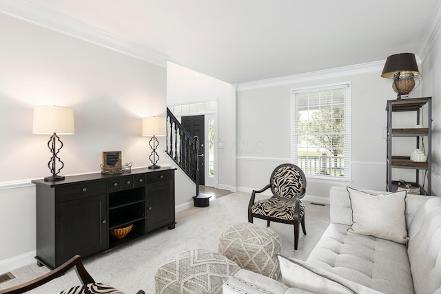living area featuring stairs, light carpet, ornamental molding, and baseboards