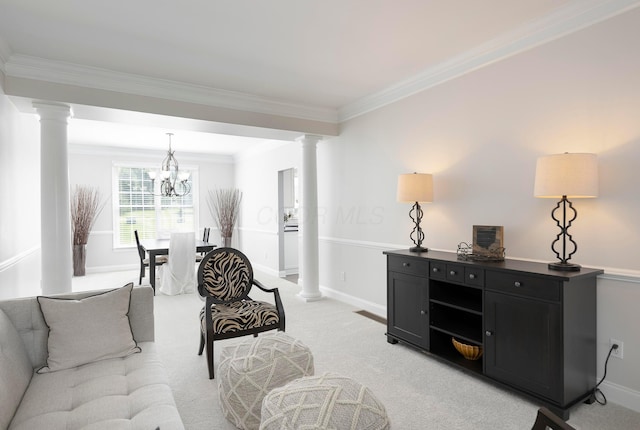 living area with decorative columns, light carpet, a chandelier, ornamental molding, and baseboards