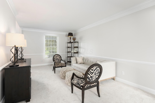 sitting room featuring crown molding, carpet, and baseboards