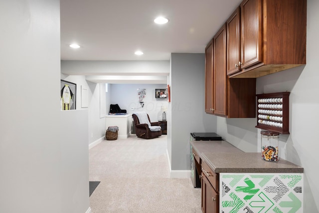 corridor with light colored carpet, recessed lighting, and baseboards