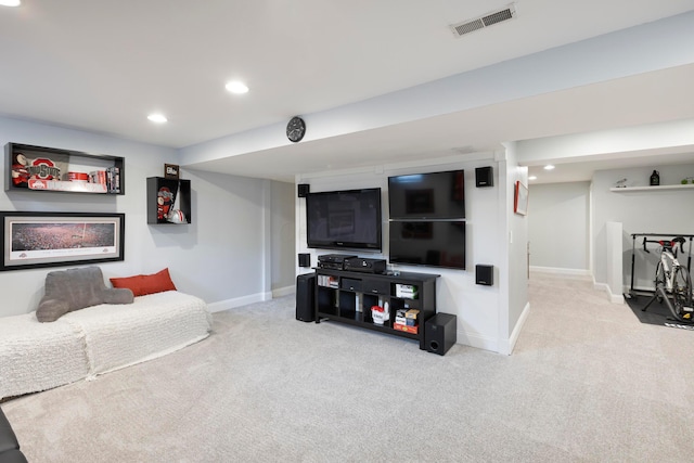 carpeted living area featuring baseboards and recessed lighting