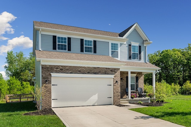 249 Rochdale, Delaware, OH 43015 - view of front facade featuring a porch, driveway, a garage, and brick siding