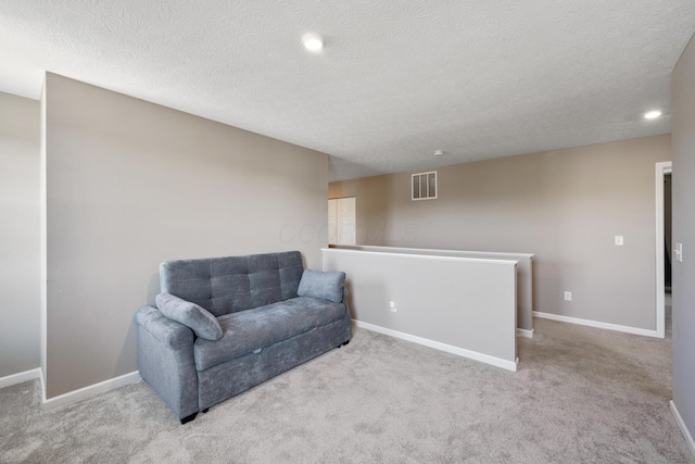 249 Rochdale, Delaware, OH 43015 - sitting room with an upstairs landing, a textured ceiling, carpet floors, baseboards, and recessed lighting