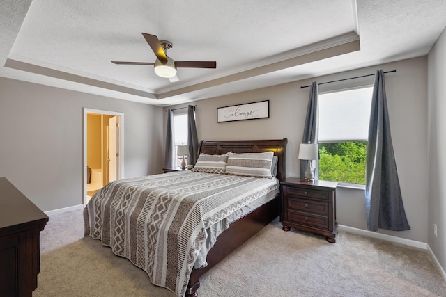 249 Rochdale, Delaware, OH 43015 - bedroom featuring a tray ceiling, light carpet, a textured ceiling, baseboards, and a ceiling fan