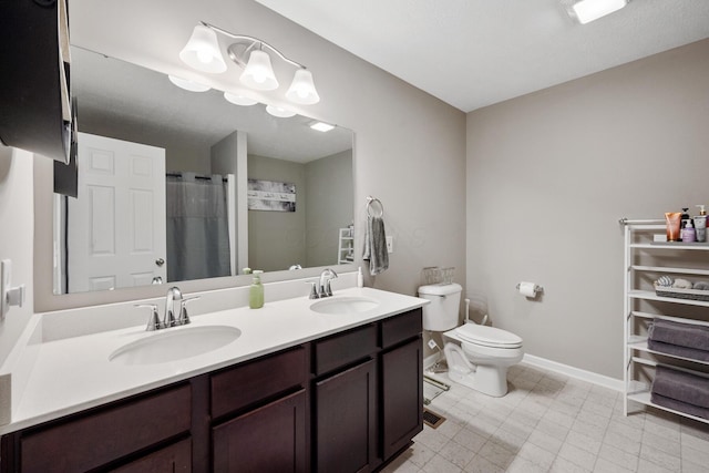 249 Rochdale, Delaware, OH 43015 - bathroom featuring toilet, double vanity, baseboards, and curtained shower