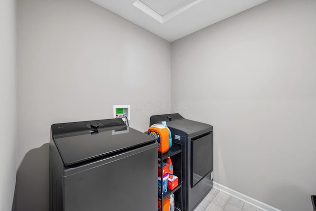 249 Rochdale, Delaware, OH 43015 - laundry area featuring washer and clothes dryer, baseboards, and light tile patterned flooring