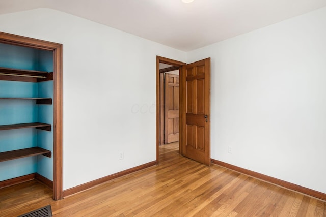 unfurnished room featuring light wood-type flooring and baseboards