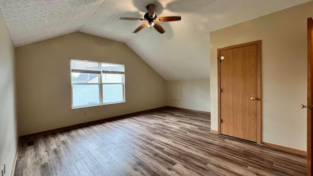 5332 Wadley Ct, Canal Winchester, OH 43110 - bonus room with wood finished floors, a ceiling fan, lofted ceiling, baseboards, and a textured ceiling