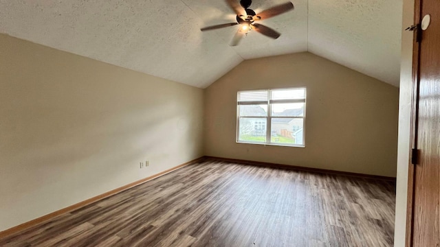 5332 Wadley Ct, Canal Winchester, OH 43110 - additional living space with wood finished floors, a ceiling fan, vaulted ceiling, a textured ceiling, and baseboards