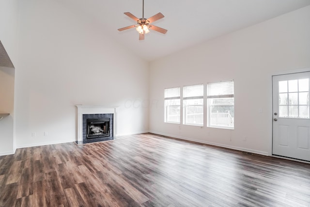 5332 Wadley Ct, Canal Winchester, OH 43110 - unfurnished living room featuring high vaulted ceiling, wood finished floors, ceiling fan, and a tile fireplace