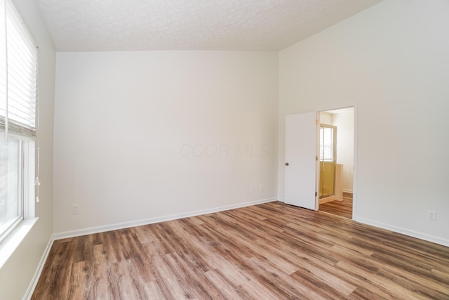 5332 Wadley Ct, Canal Winchester, OH 43110 - spare room featuring wood finished floors, plenty of natural light, and a textured ceiling
