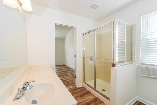 5332 Wadley Ct, Canal Winchester, OH 43110 - bathroom with wood finished floors, a shower stall, and vanity