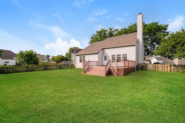 5332 Wadley Ct, Canal Winchester, OH 43110 - rear view of house featuring a fenced backyard, a deck, a chimney, and a shingled roof