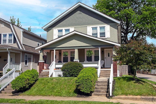 1306-1308 Wilson Ave, Columbus, OH 43206 - traditional style home with covered porch, stairs, and a front lawn