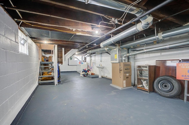 1306-1308 Wilson Ave, Columbus, OH 43206 - below grade area featuring washer / clothes dryer, heating unit, concrete block wall, and stairs