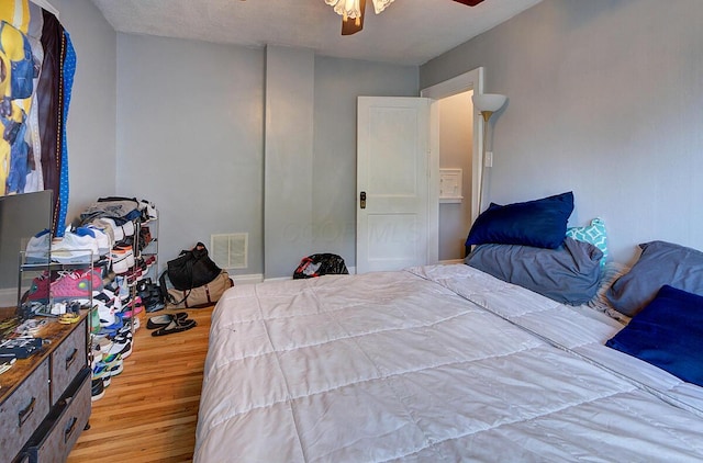 1306-1308 Wilson Ave, Columbus, OH 43206 - bedroom featuring wood finished floors, ceiling fan, and baseboards