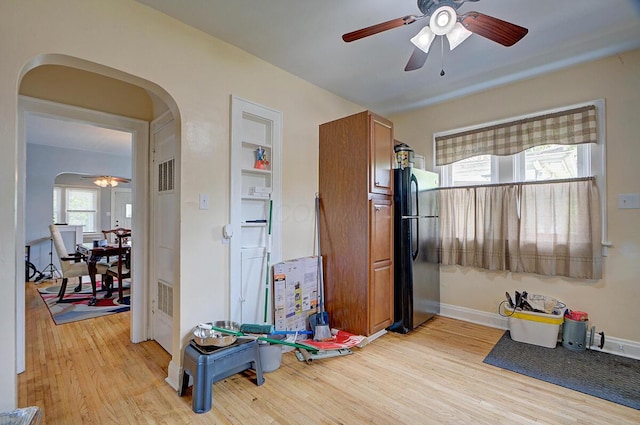 1306-1308 Wilson Ave, Columbus, OH 43206 - playroom featuring arched walkways, ceiling fan, light wood finished floors, and baseboards