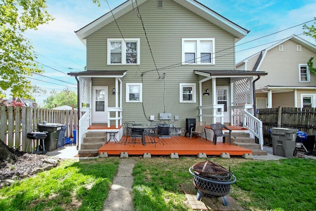1306-1308 Wilson Ave, Columbus, OH 43206 - back of property featuring an outdoor fire pit, cooling unit, and a wooden deck