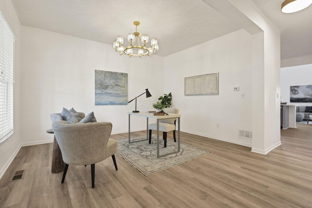 3907 Winding Path Dr, Canal Winchester, OH 43110 - office area with wood finished floors, baseboards, and a chandelier