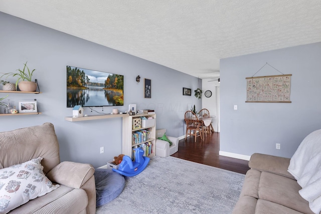 230 Clover Ct, Newark, OH 43055 - living area with wood finished floors, baseboards, and a textured ceiling