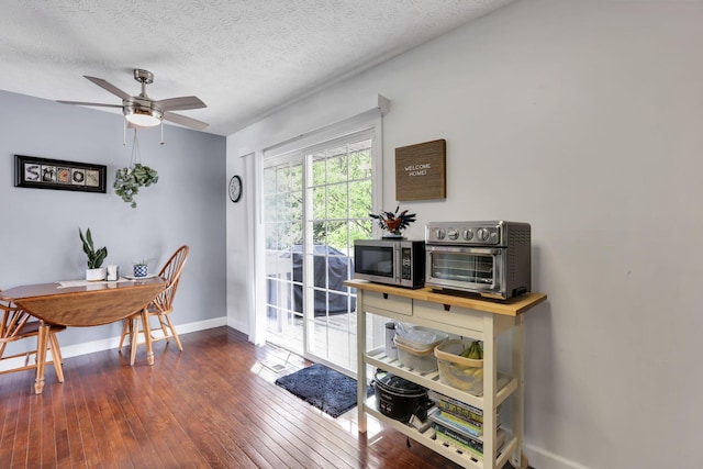 230 Clover Ct, Newark, OH 43055 - dining room featuring baseboards, a ceiling fan, hardwood / wood-style flooring, and a textured ceiling