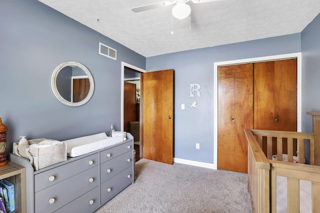 230 Clover Ct, Newark, OH 43055 - bedroom with carpet floors, a closet, a textured ceiling, a ceiling fan, and baseboards