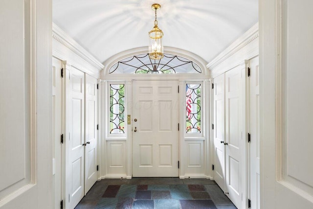 324 E N Broadway St, Columbus, OH 43214 - foyer featuring dark stone finish flooring, a chandelier, and vaulted ceiling