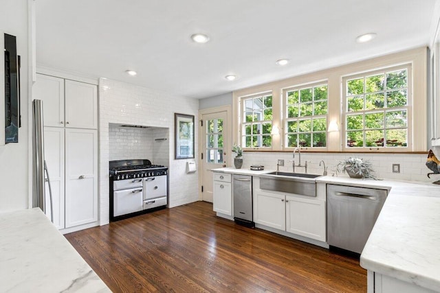 324 E N Broadway St, Columbus, OH 43214 - kitchen featuring appliances with stainless steel finishes, a sink, decorative backsplash, dark wood-style floors, and recessed lighting