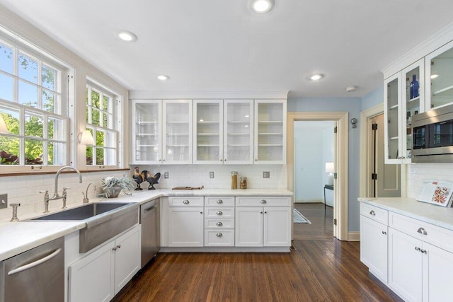 324 E N Broadway St, Columbus, OH 43214 - kitchen featuring stainless steel appliances, backsplash, white cabinets, and recessed lighting