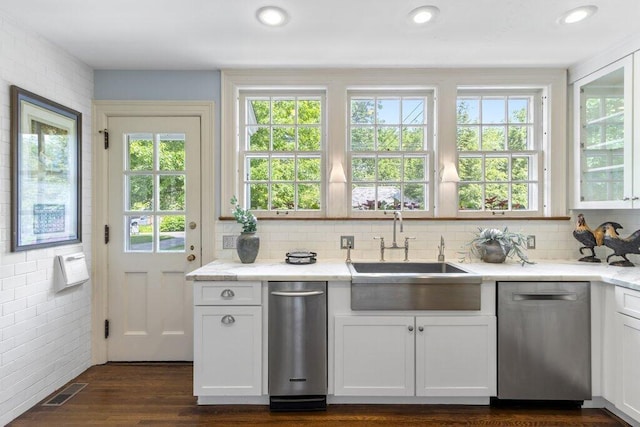 324 E N Broadway St, Columbus, OH 43214 - kitchen with stainless steel dishwasher, a sink, white cabinetry, and recessed lighting