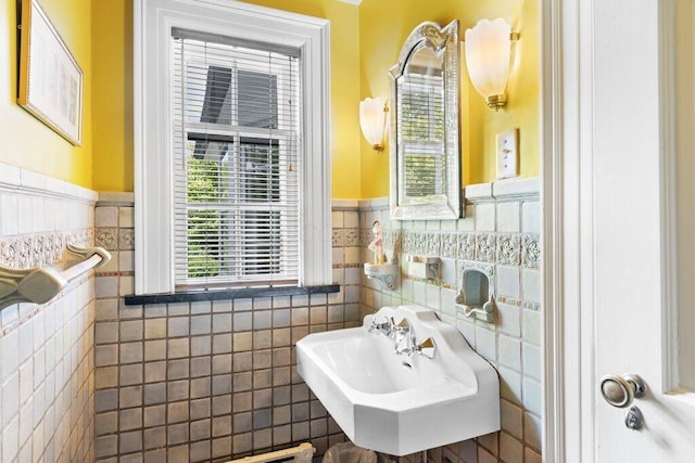 324 E N Broadway St, Columbus, OH 43214 - bathroom featuring tile walls, wainscoting, and a sink