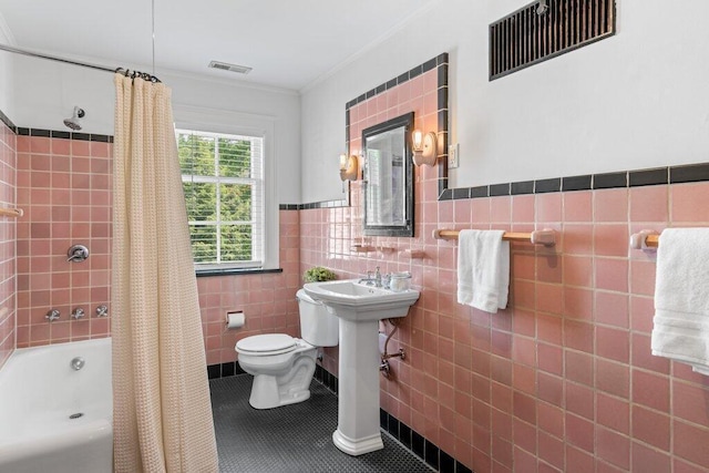 324 E N Broadway St, Columbus, OH 43214 - full bath with toilet, shower / tub combo with curtain, tile walls, tile patterned floors, and crown molding