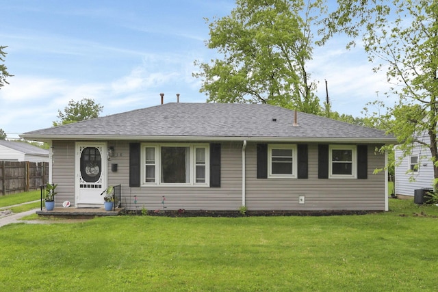 view of front facade featuring cooling unit and roof with shingles