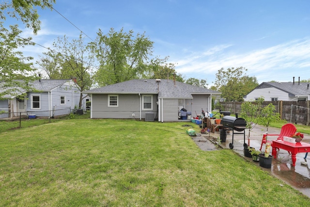 rear view of house featuring a patio area, cooling unit, and roof with shingles