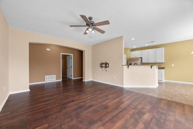 9032 Polaris Lakes Dr, Columbus, OH 43240 - unfurnished living room with a ceiling fan, wood finished floors, baseboards, and recessed lighting
