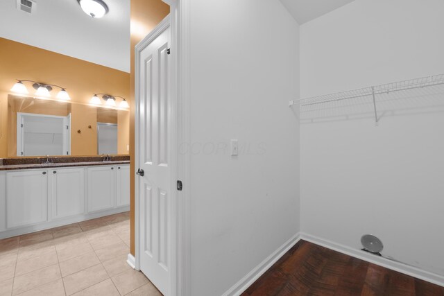 9032 Polaris Lakes Dr, Columbus, OH 43240 - laundry area featuring baseboards and a sink