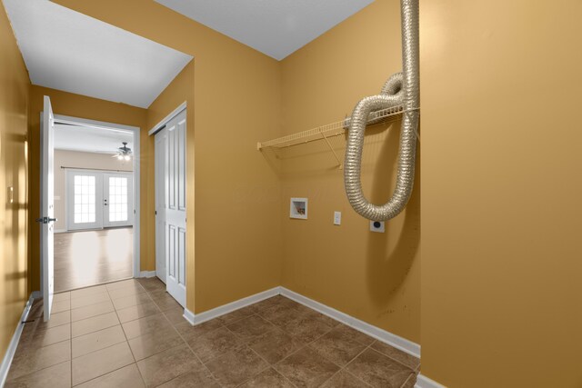 9032 Polaris Lakes Dr, Columbus, OH 43240 - clothes washing area featuring hookup for a washing machine, hookup for an electric dryer, baseboards, dark tile patterned floors, and a ceiling fan