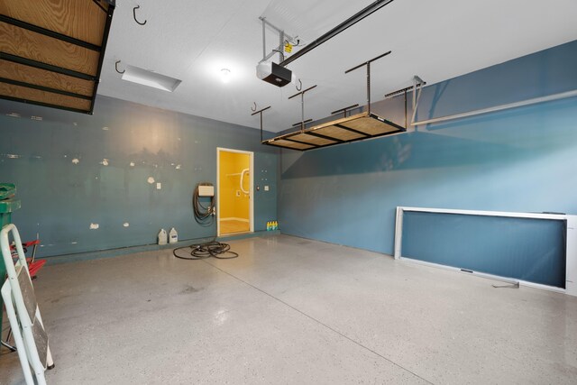 9032 Polaris Lakes Dr, Columbus, OH 43240 - garage with a garage door opener