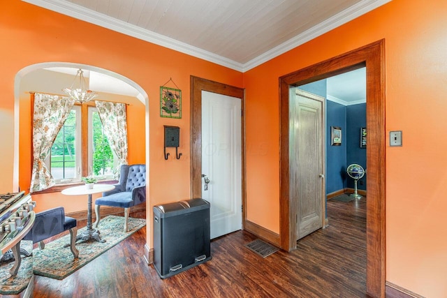 1674 Melrose Ave, Columbus, OH 43224 - sitting room with arched walkways, wood finished floors, baseboards, ornamental molding, and a chandelier