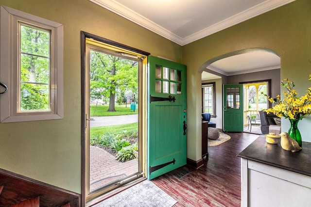1674 Melrose Ave, Columbus, OH 43224 - entryway featuring arched walkways, crown molding, dark wood-style floors, and baseboards