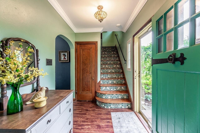 1674 Melrose Ave, Columbus, OH 43224 - foyer featuring dark wood-style flooring, crown molding, arched walkways, and stairs
